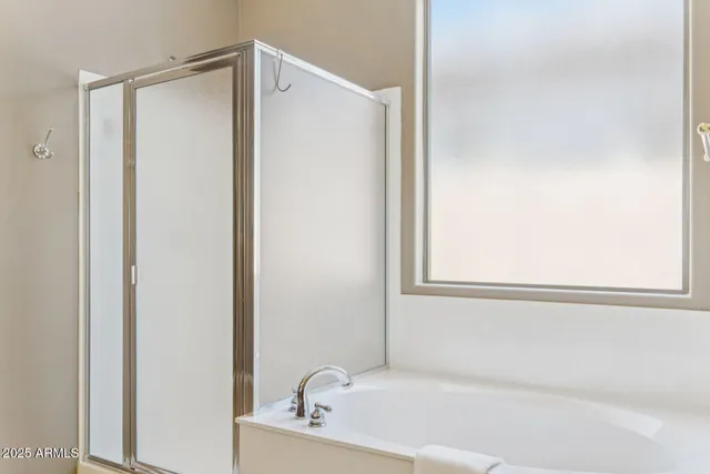 a white bath tub with a sink