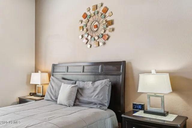 a bed room with a bed and a night stand