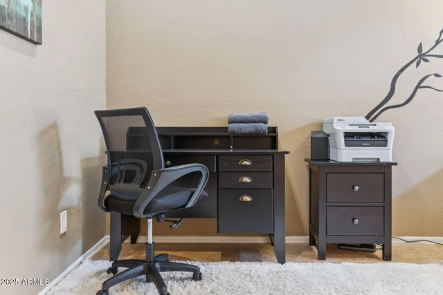 a work room with furniture and wooden floor