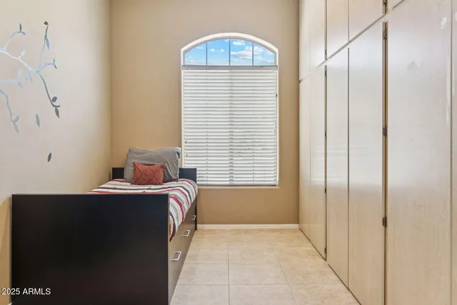 a room that has a bed and a window