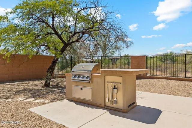 a view of a backyard with furniture