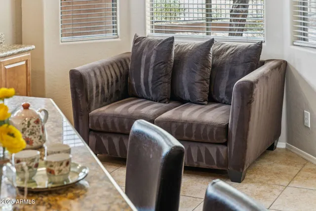 a living room with a couch and a window