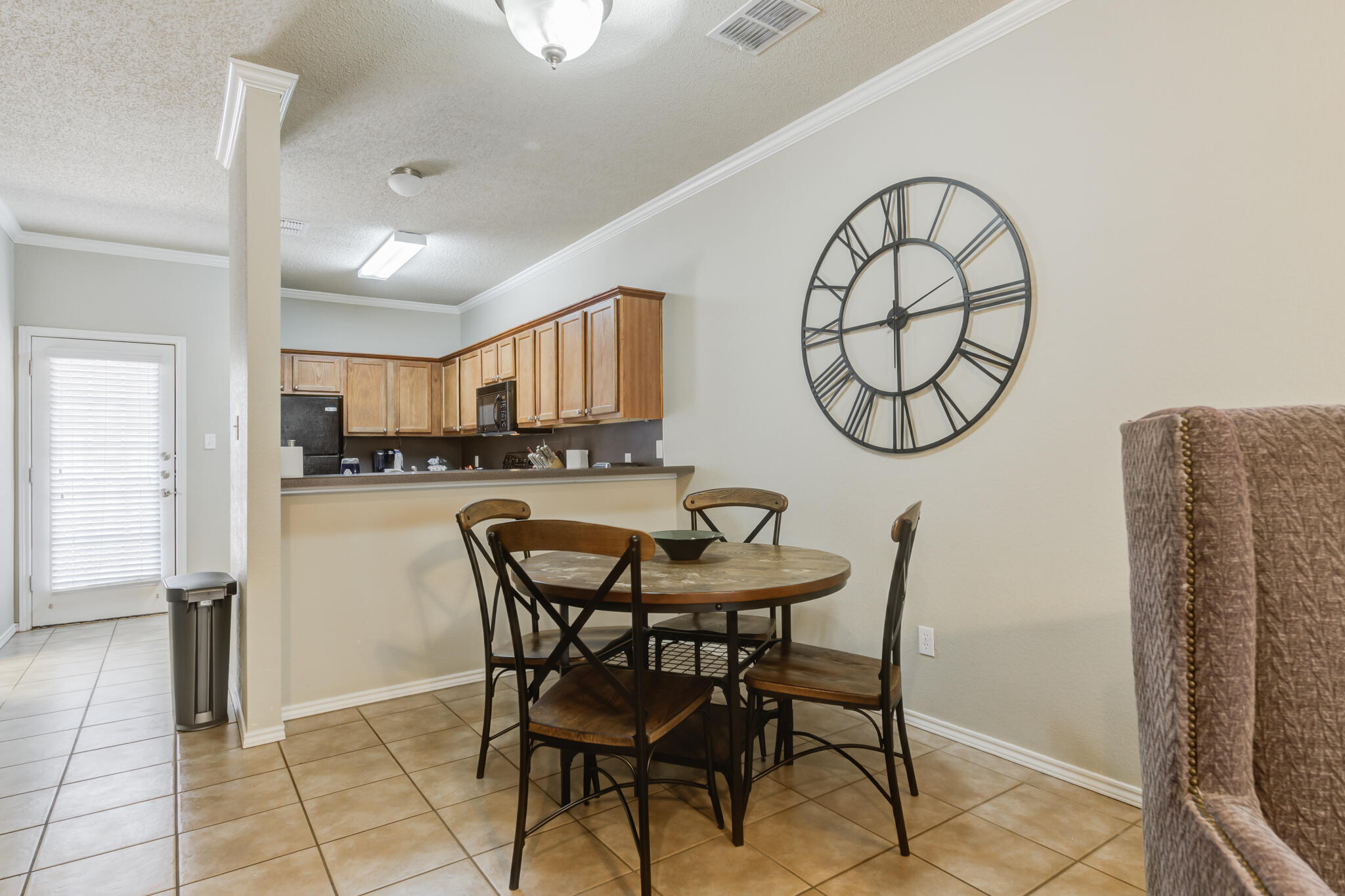 2111 Main Street, Unit 3 Lubbock, TX 79401 - Photo 14 of 49 a view of a dining room with furniture and a kitchen view