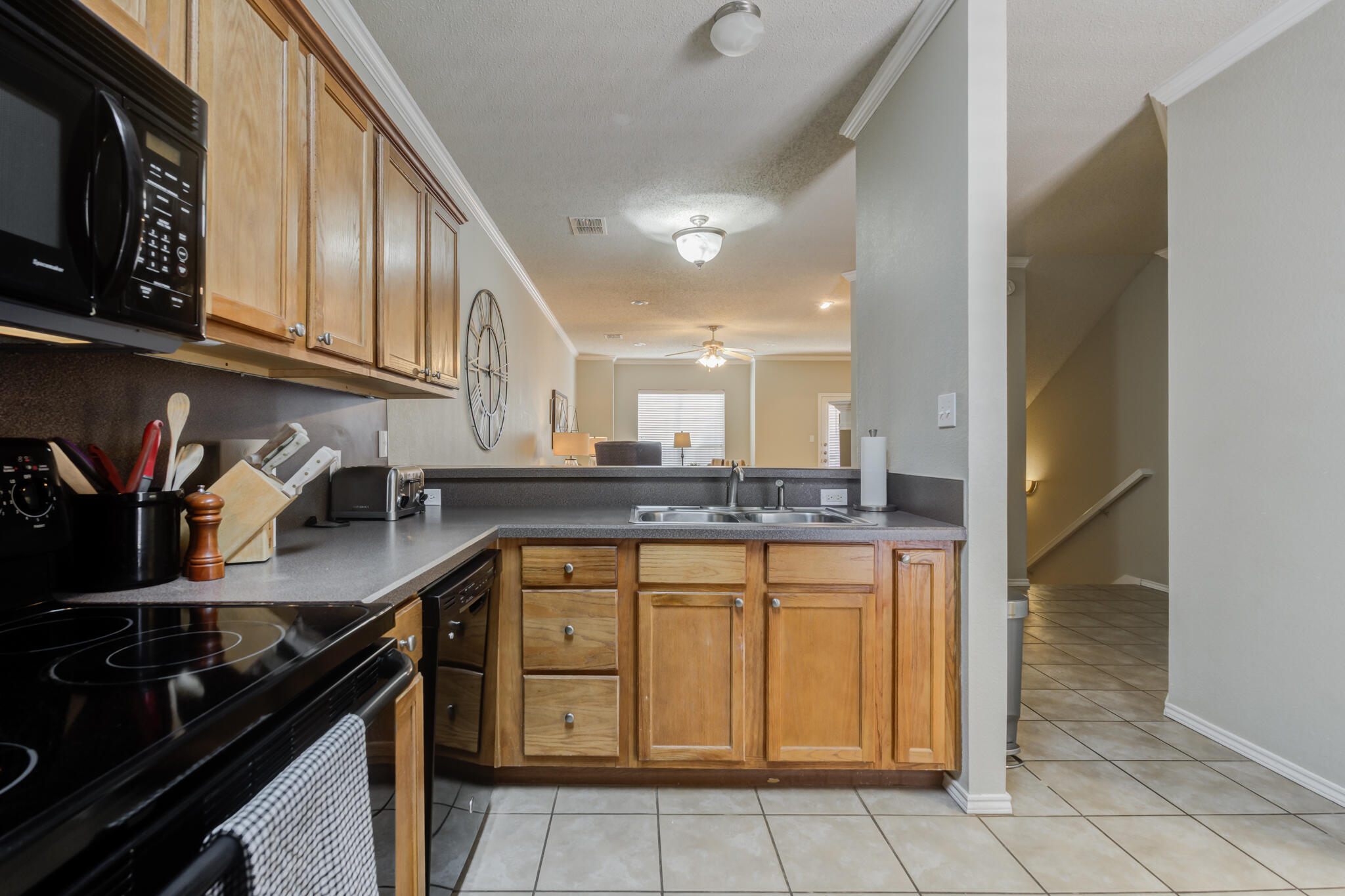 2111 Main Street, Unit 3 Lubbock, TX 79401 - Photo 18 of 49 a kitchen with stainless steel appliances granite countertop a sink and cabinets