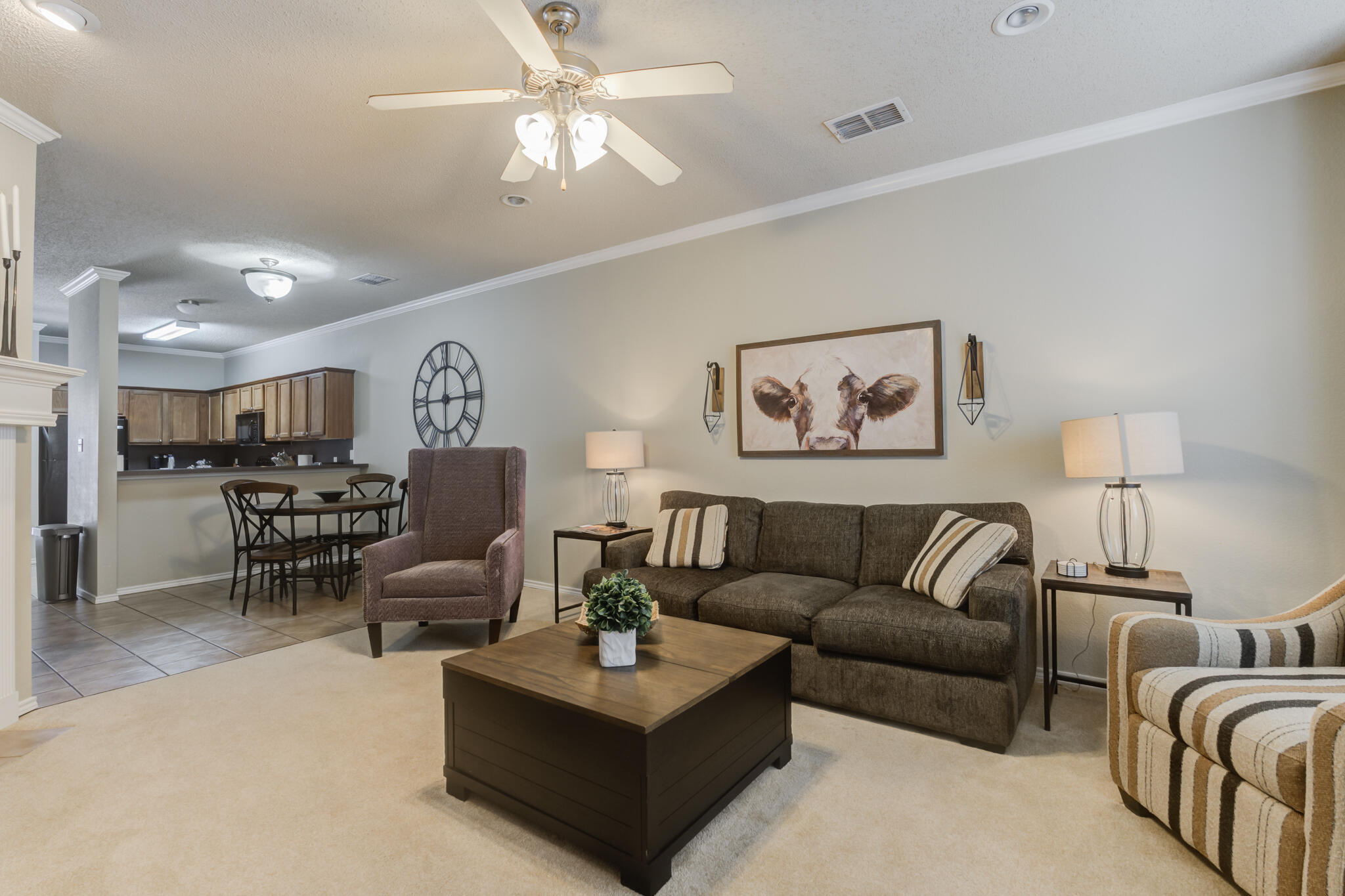 2111 Main Street, Unit 3 Lubbock, TX 79401 - Photo 24 of 49 a living room with furniture a lamp and a chandelier