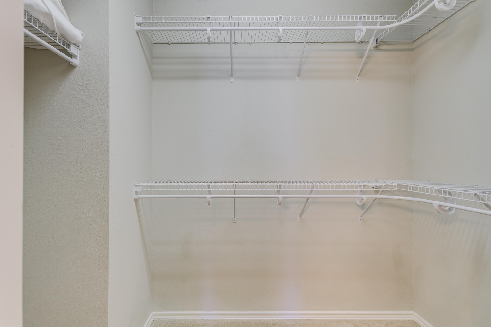 2111 Main Street, Unit 3 Lubbock, TX 79401 - Photo 37 of 49 a view of a room with racks on the wall