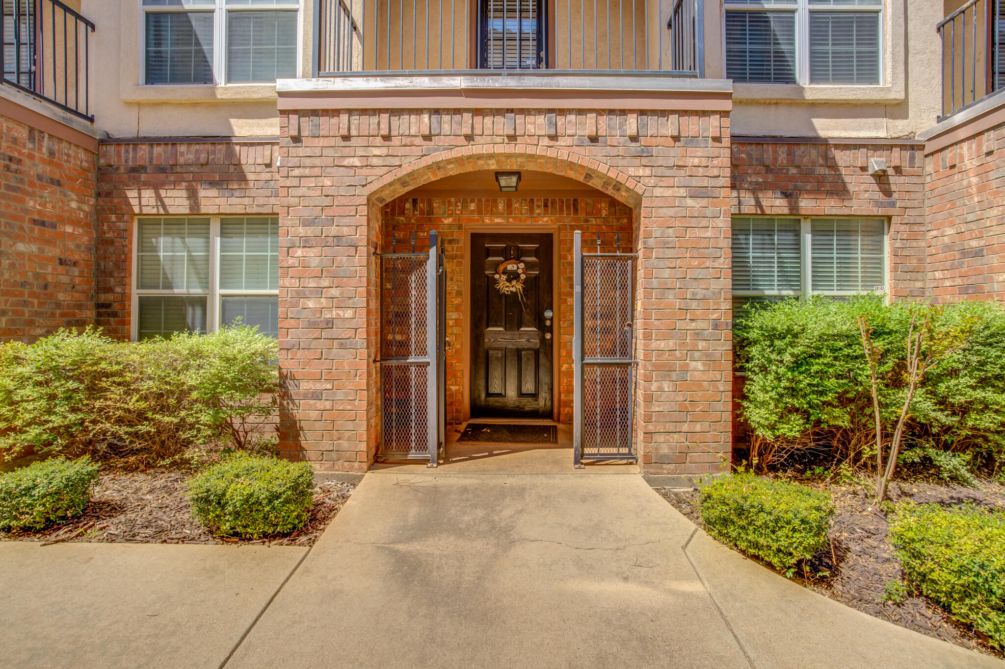2111 Main Street, Unit 3 Lubbock, TX 79401 - Photo 4 of 49 front view of a brick house with a small porch
