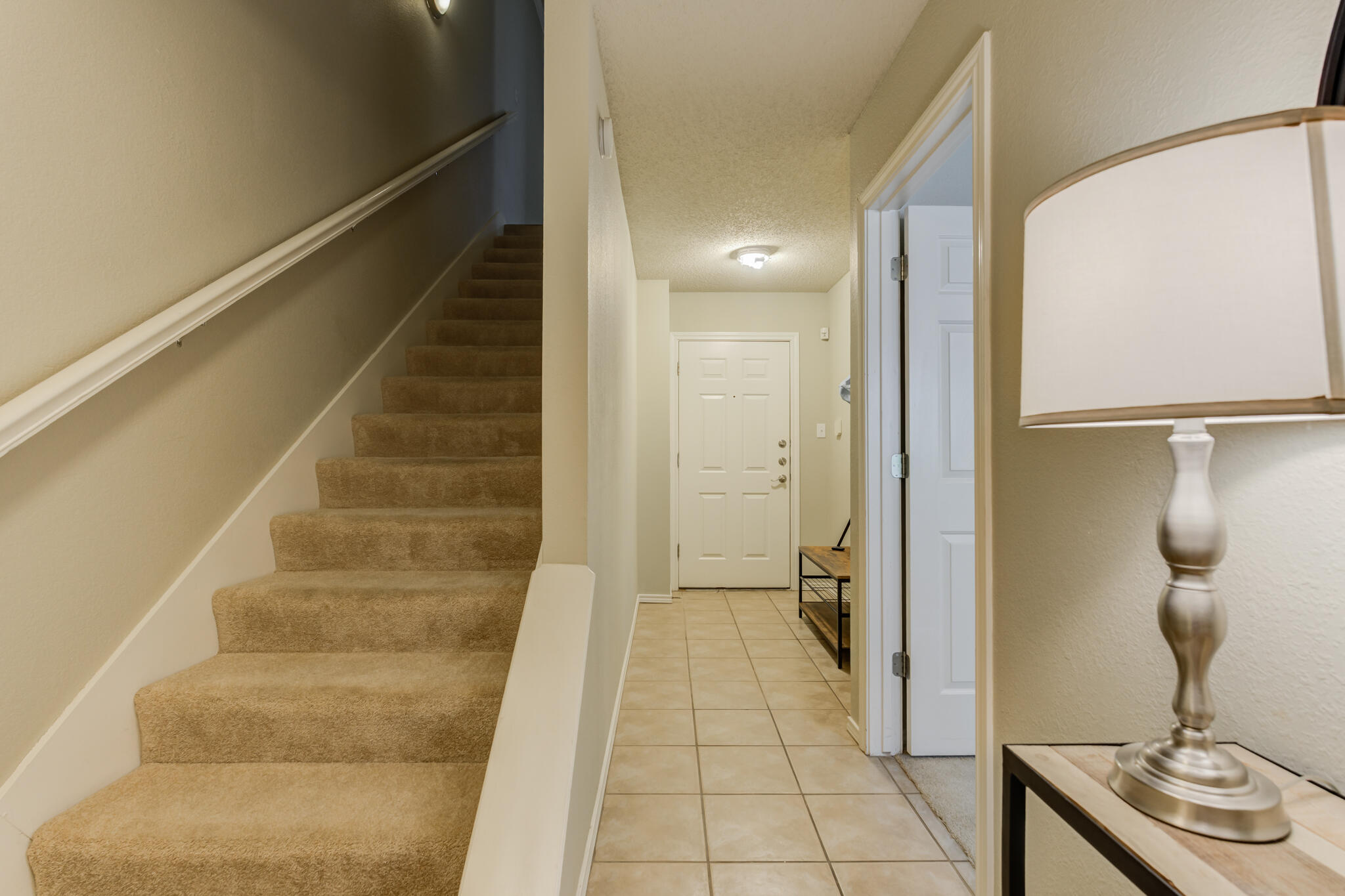2111 Main Street, Unit 3 Lubbock, TX 79401 - Photo 5 of 49 a view of a hallway with wooden floor and entryway