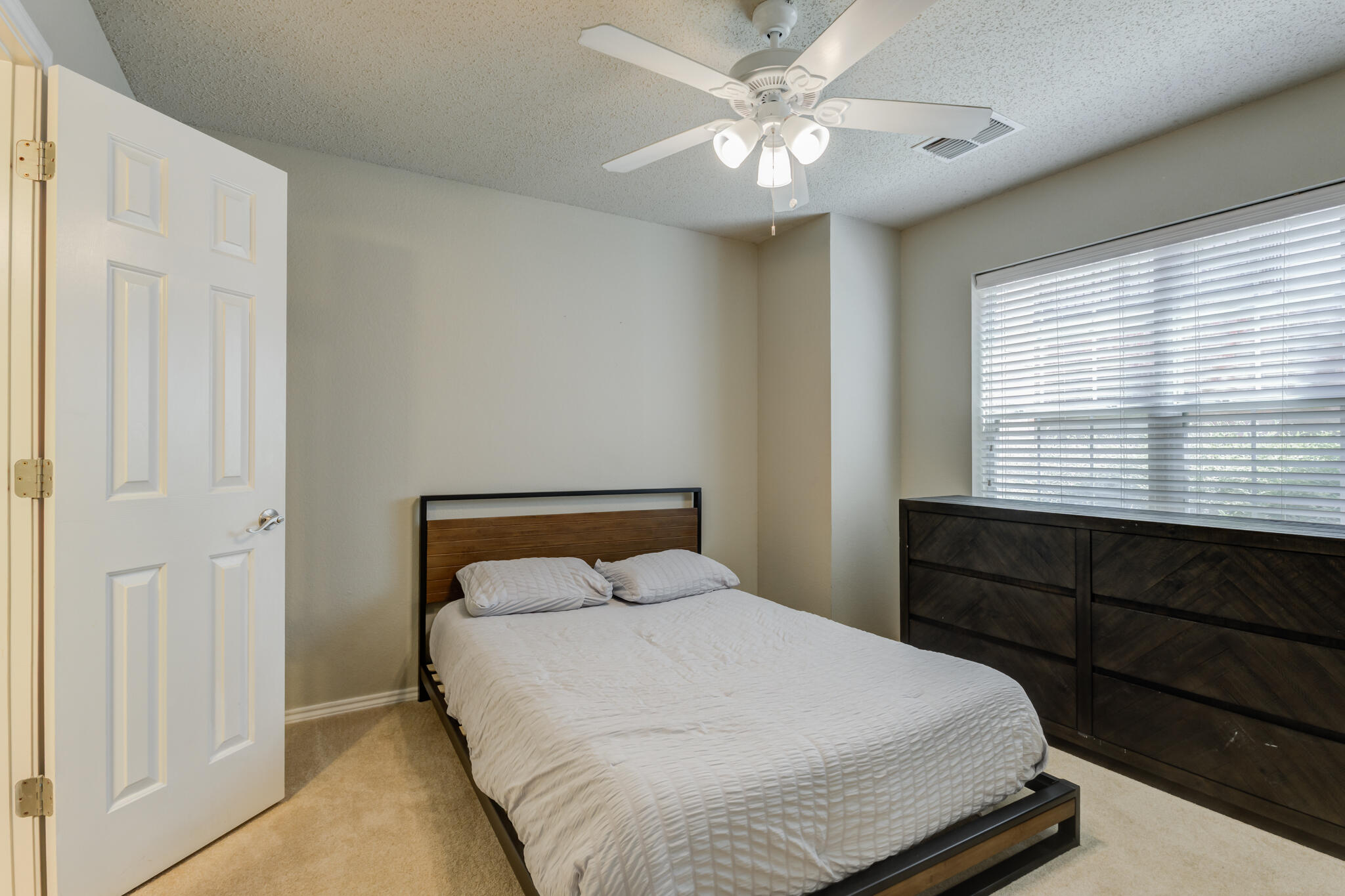 2111 Main Street, Unit 3 Lubbock, TX 79401 - Photo 8 of 49 a bedroom with a bed and a window