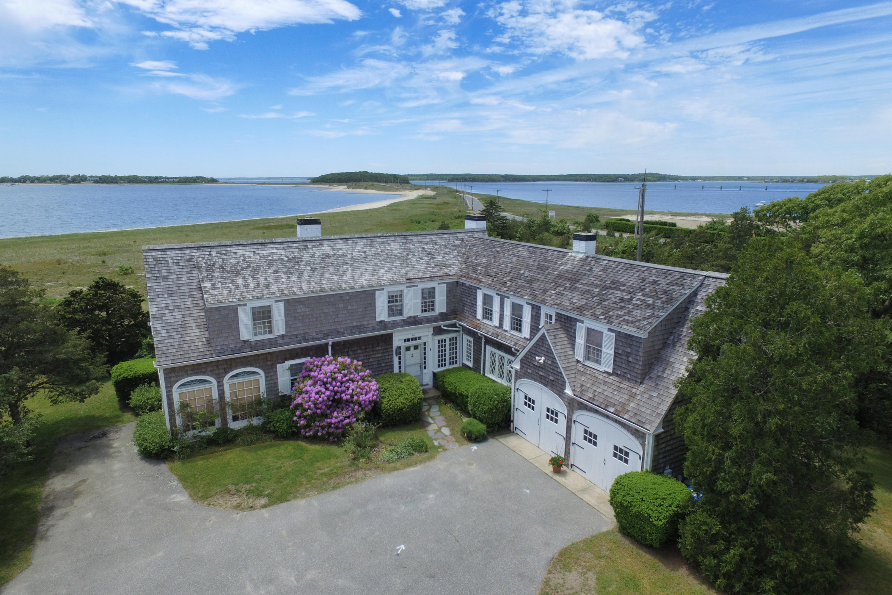 80 Rocky Point Road Bourne, MA 02532 - Photo 1 of 22 aerial view of a house with a yard and potted plants