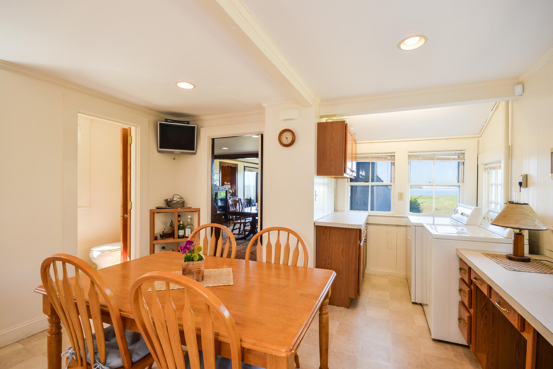 80 Rocky Point Road Bourne, MA 02532 - Photo 14 of 22 a view of a dining room with furniture and wooden floor