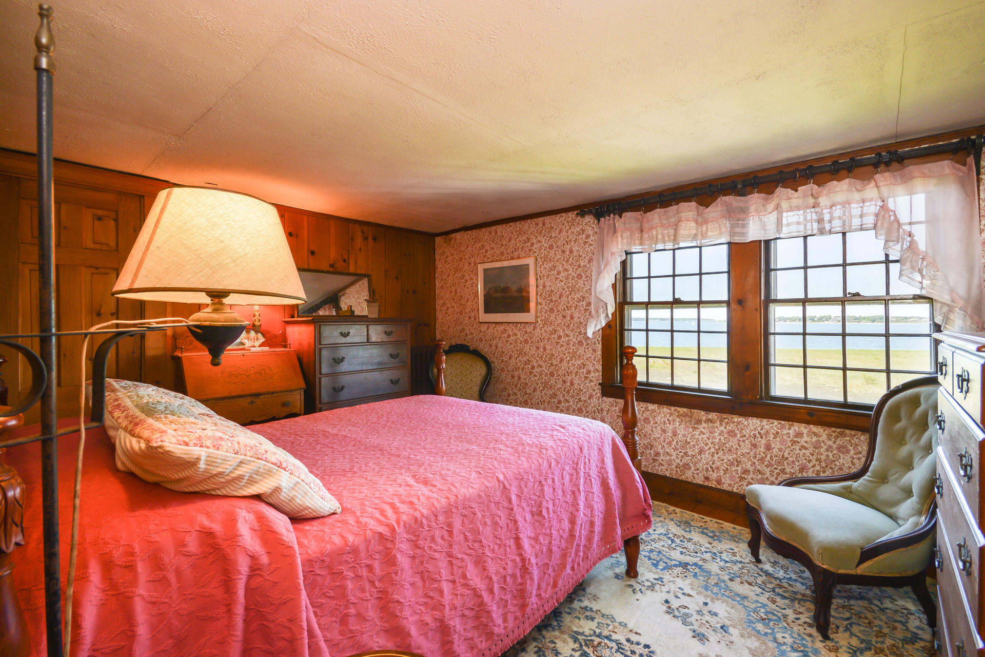 80 Rocky Point Road Bourne, MA 02532 - Photo 17 of 22 a bedroom with a bed and glass window