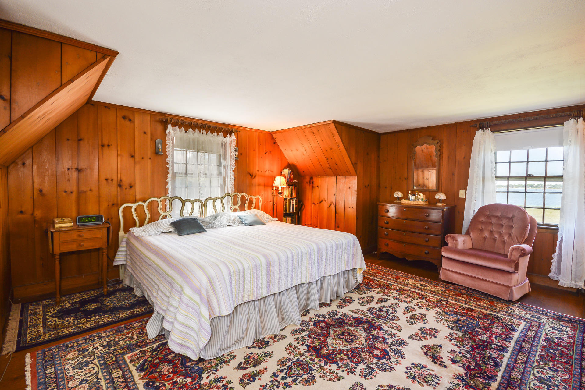 80 Rocky Point Road Bourne, MA 02532 - Photo 18 of 22 a bedroom with a bed and wooden floor