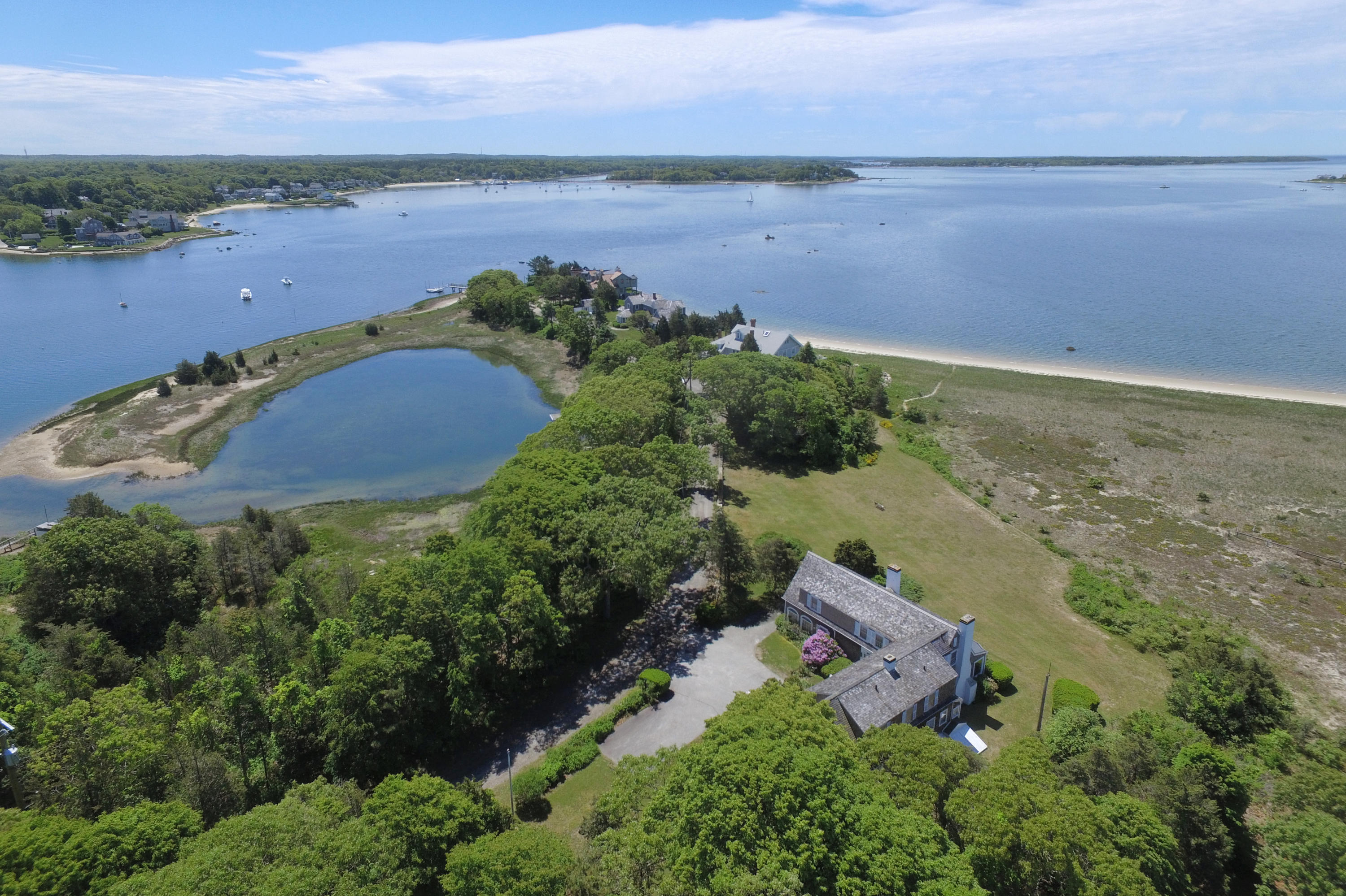 80 Rocky Point Road Bourne, MA 02532 - Photo 2 of 22 an aerial view of a house with a lake view