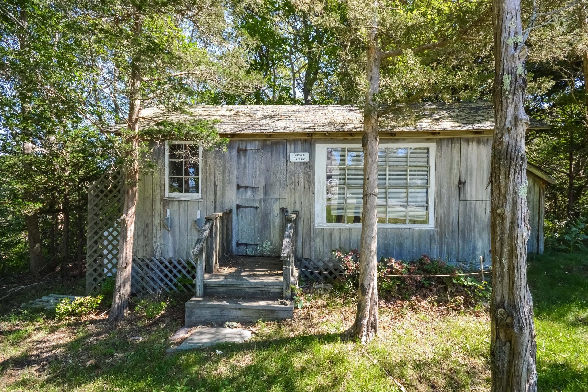 80 Rocky Point Road Bourne, MA 02532 - Photo 19 of 22 a view of a house with a yard
