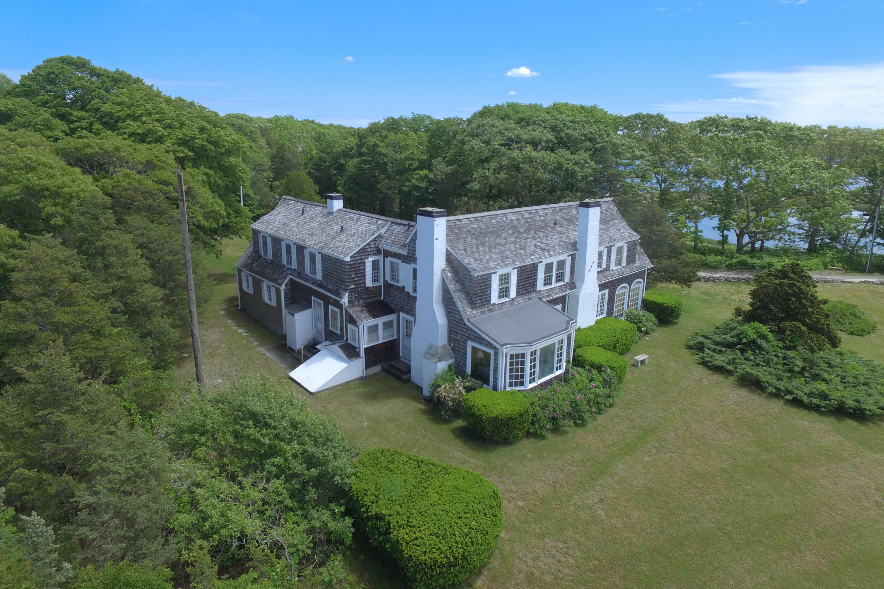 80 Rocky Point Road Bourne, MA 02532 - Photo 3 of 22 a view of a house with a big yard