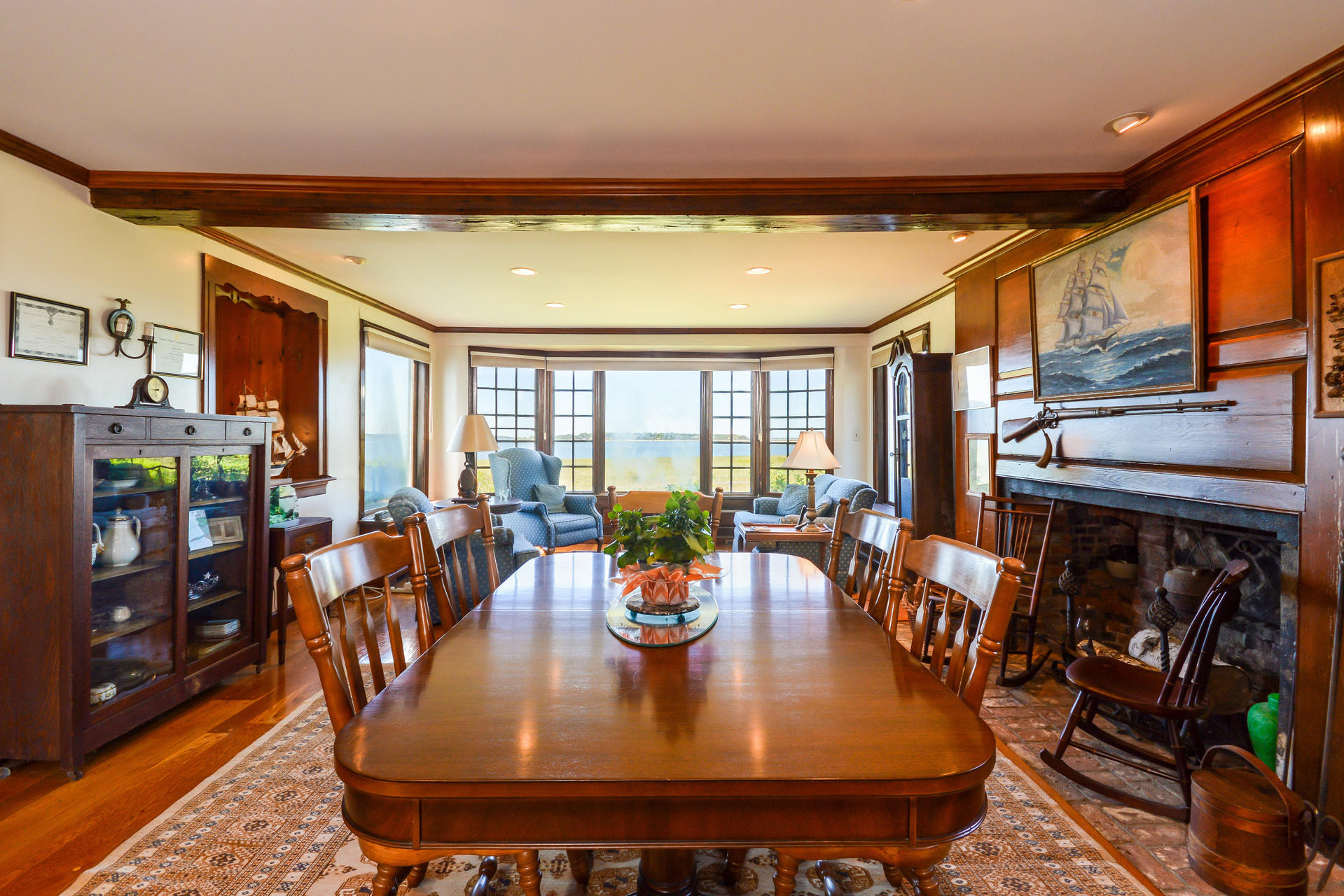 80 Rocky Point Road Bourne, MA 02532 - Photo 10 of 22 a dining room with lots of furniture and glass door