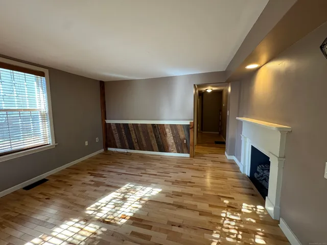 a view of livingroom with fireplace and furniture