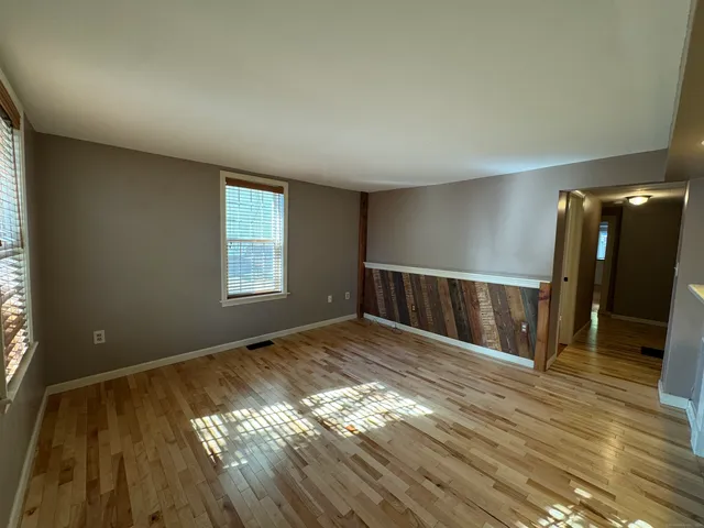 a view of entryway with wooden floor