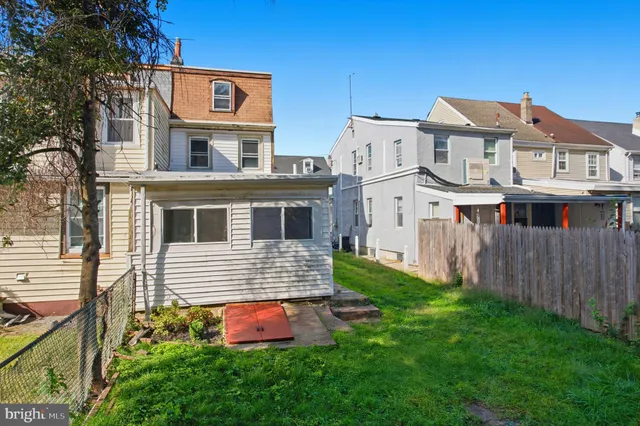 a city street filled with lots of traffic and tall buildings