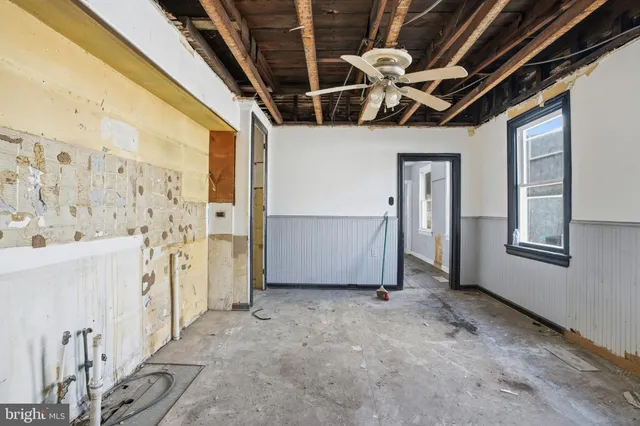 a bathroom with a shower and a sink