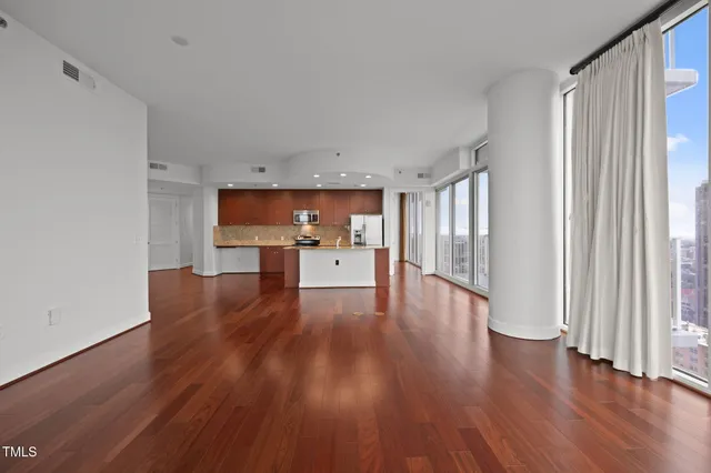 a view of a kitchen with wooden floor