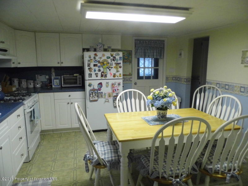 709 Spring Street Moosic, PA 18507 - Photo 4 of 11 a dining room with furniture and wooden floor