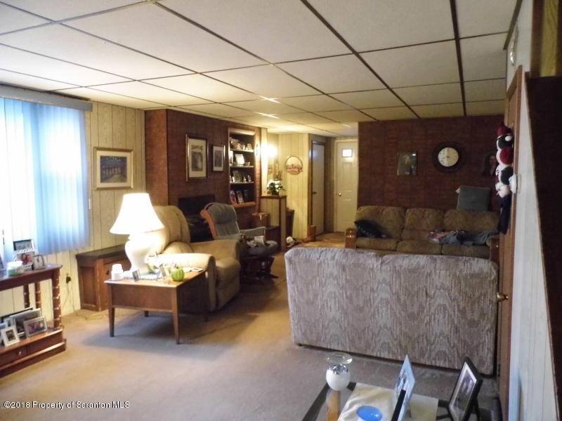 709 Spring Street Moosic, PA 18507 - Photo 6 of 11 a living room with furniture and a flat screen tv