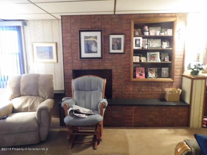 709 Spring Street Moosic, PA 18507 - Photo 7 of 11 a living room with furniture and a window
