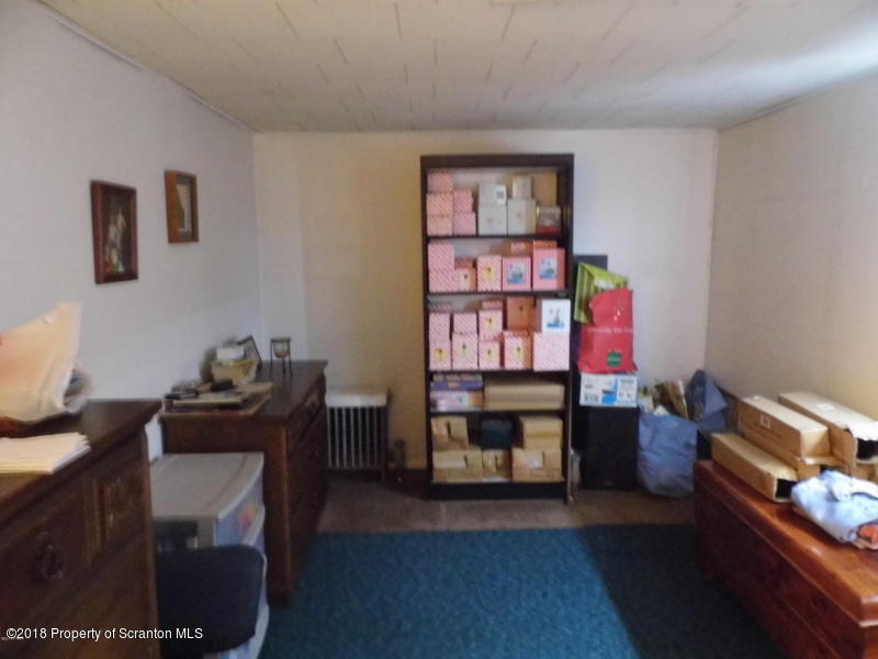 709 Spring Street Moosic, PA 18507 - Photo 10 of 11 a living room with furniture and a window