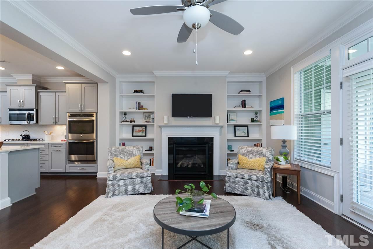637 Fallon Grove Way Raleigh, NC 27608 - Photo 14 of 30 a living room with furniture fireplace and flat screen tv