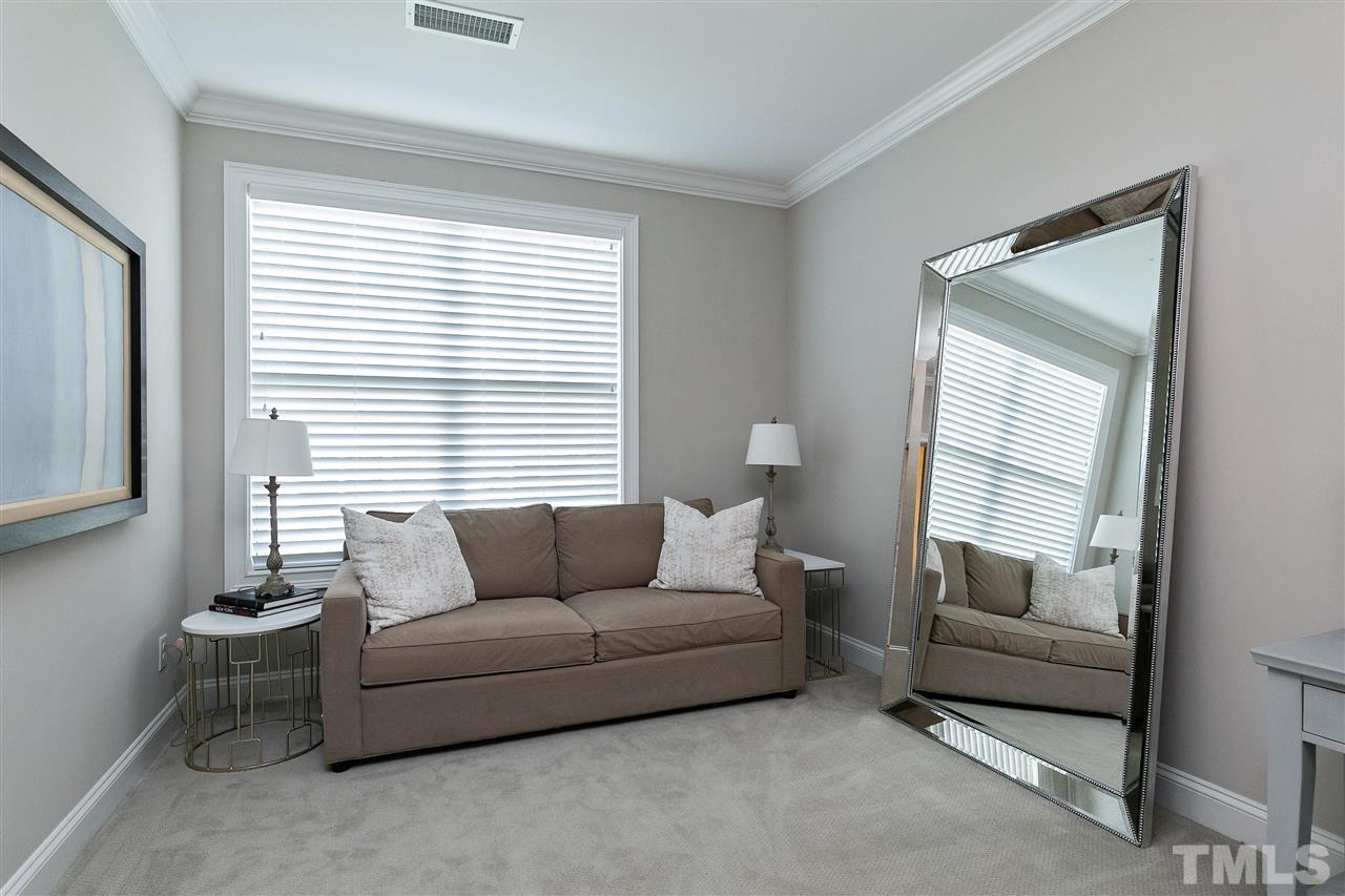 637 Fallon Grove Way Raleigh, NC 27608 - Photo 18 of 30 a living room with furniture and a window