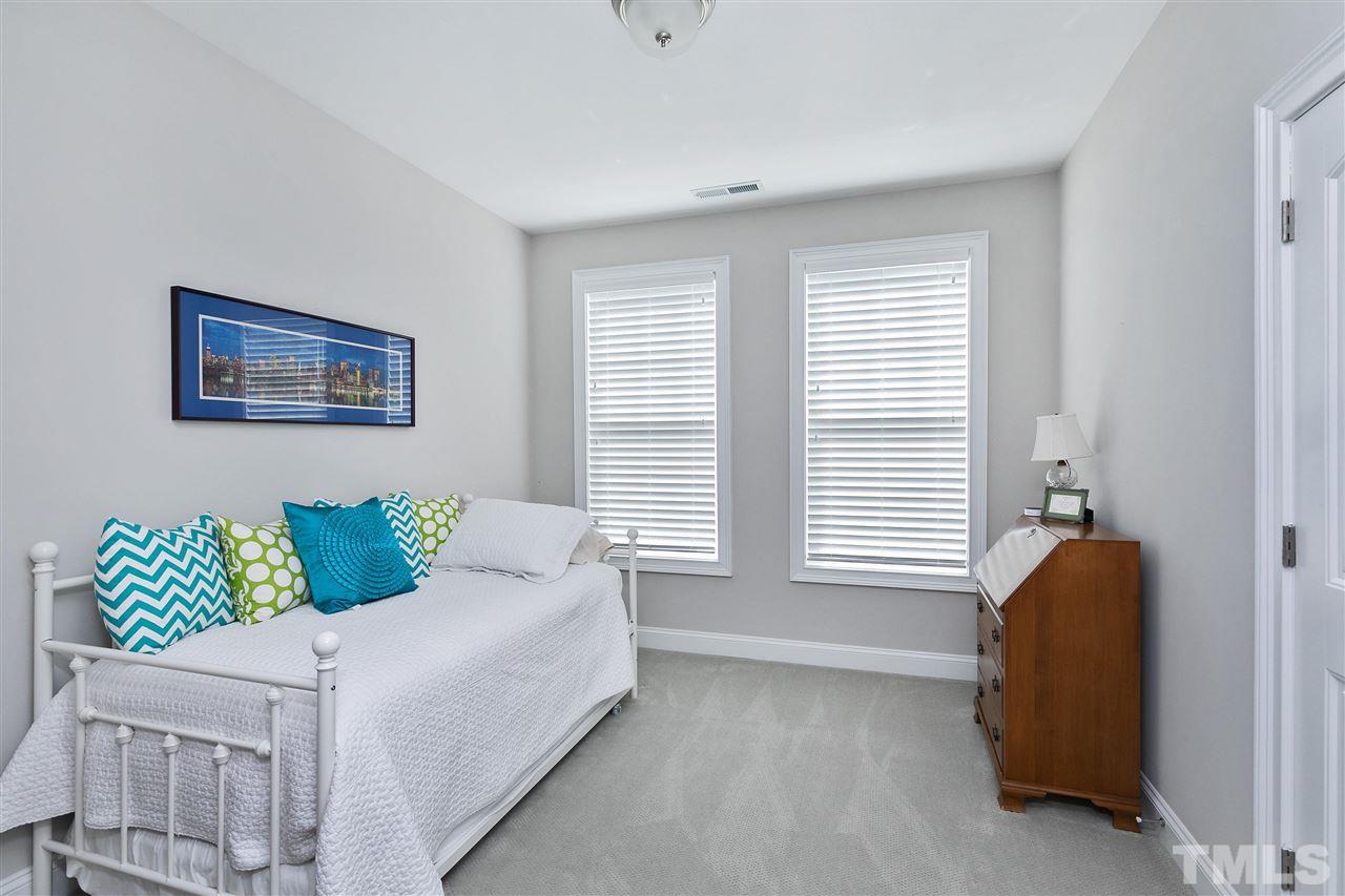 637 Fallon Grove Way Raleigh, NC 27608 - Photo 25 of 30 a bedroom with a bed and a window