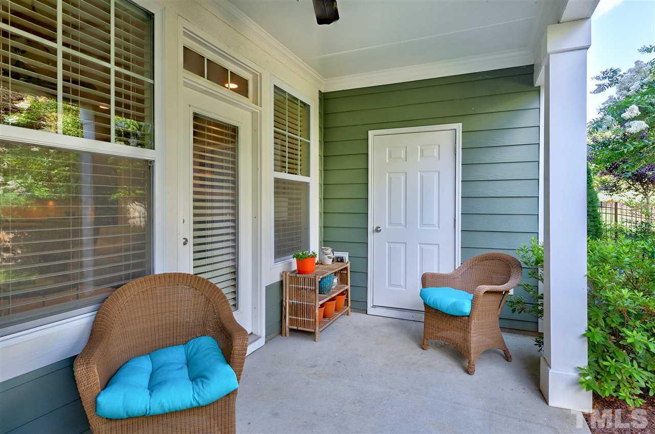 637 Fallon Grove Way Raleigh, NC 27608 - Photo 29 of 30 a backyard of a house with table and chairs