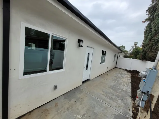 a view of a house with a large window