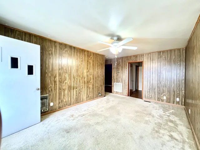 a kitchen with a sink appliances and cabinets