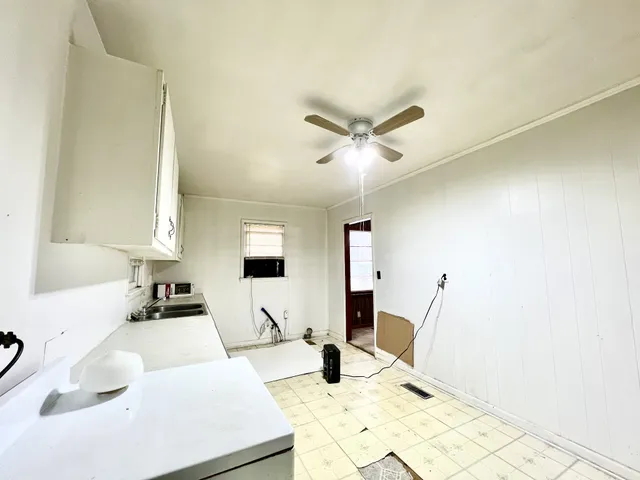 a view of a room with wooden floor