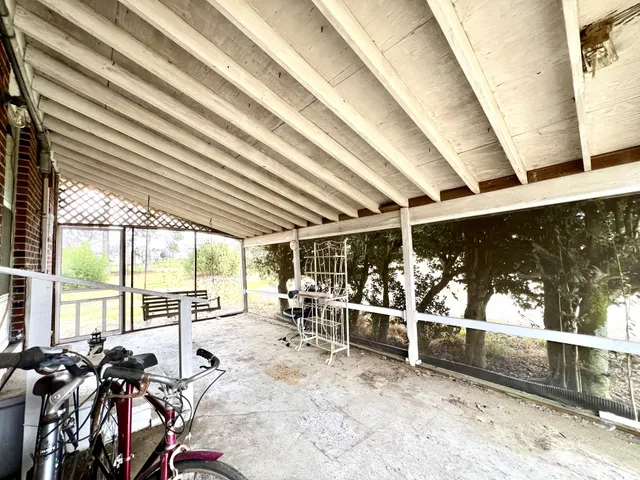 a bathroom with a mirror and a shower