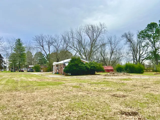 a backyard of a house with lots of green space