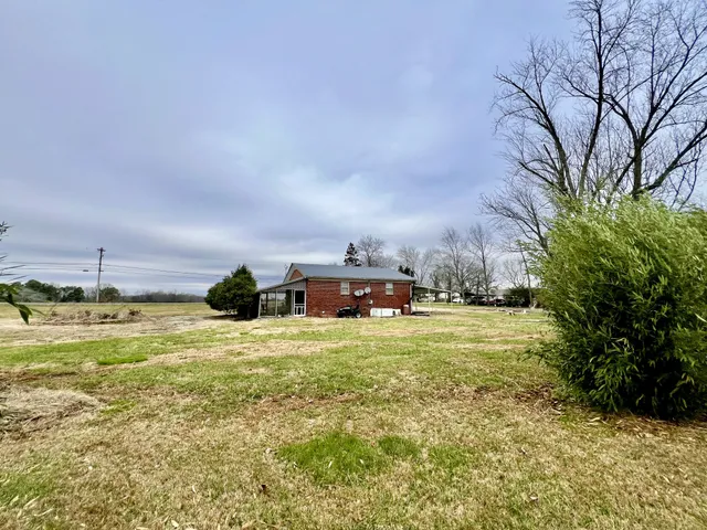 a view of a house with a tree