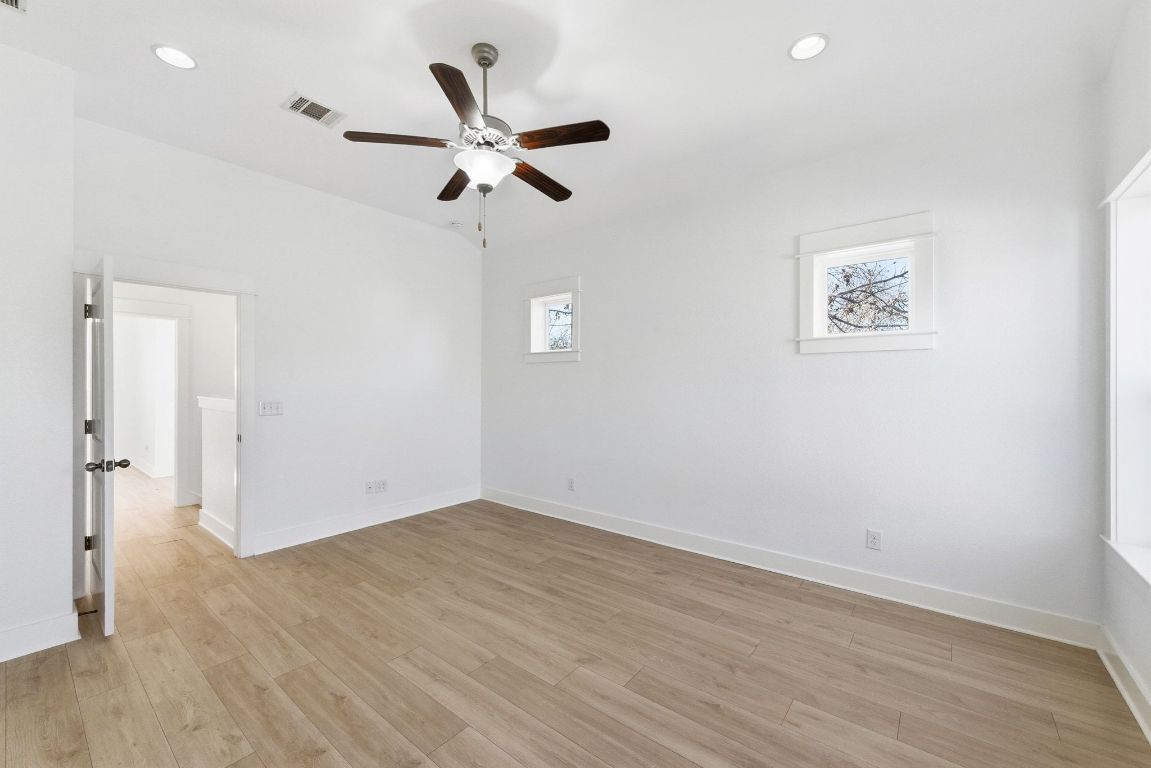 1912 Haskell Street, Unit 1 Austin, TX 78702 - Photo 11 of 23 Spare room with light wood-style flooring, ceiling fan, and recessed lighting