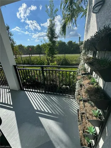 a view of balcony with wooden floor
