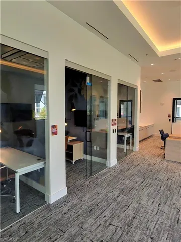 a living room with furniture a dining table and chairs