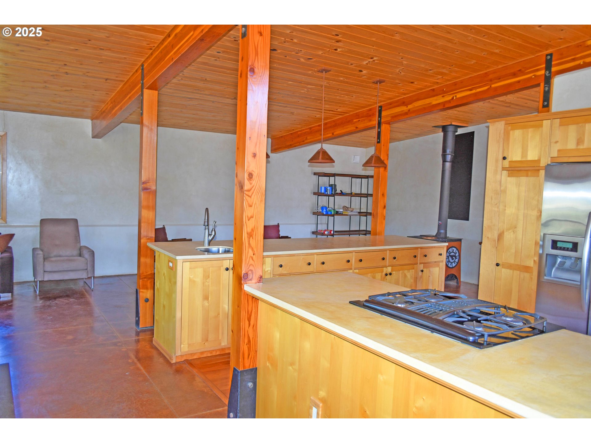 47345 Ritter Road Long Creek, OR 97856 - Photo 16 of 48 a living room with a table and chairs