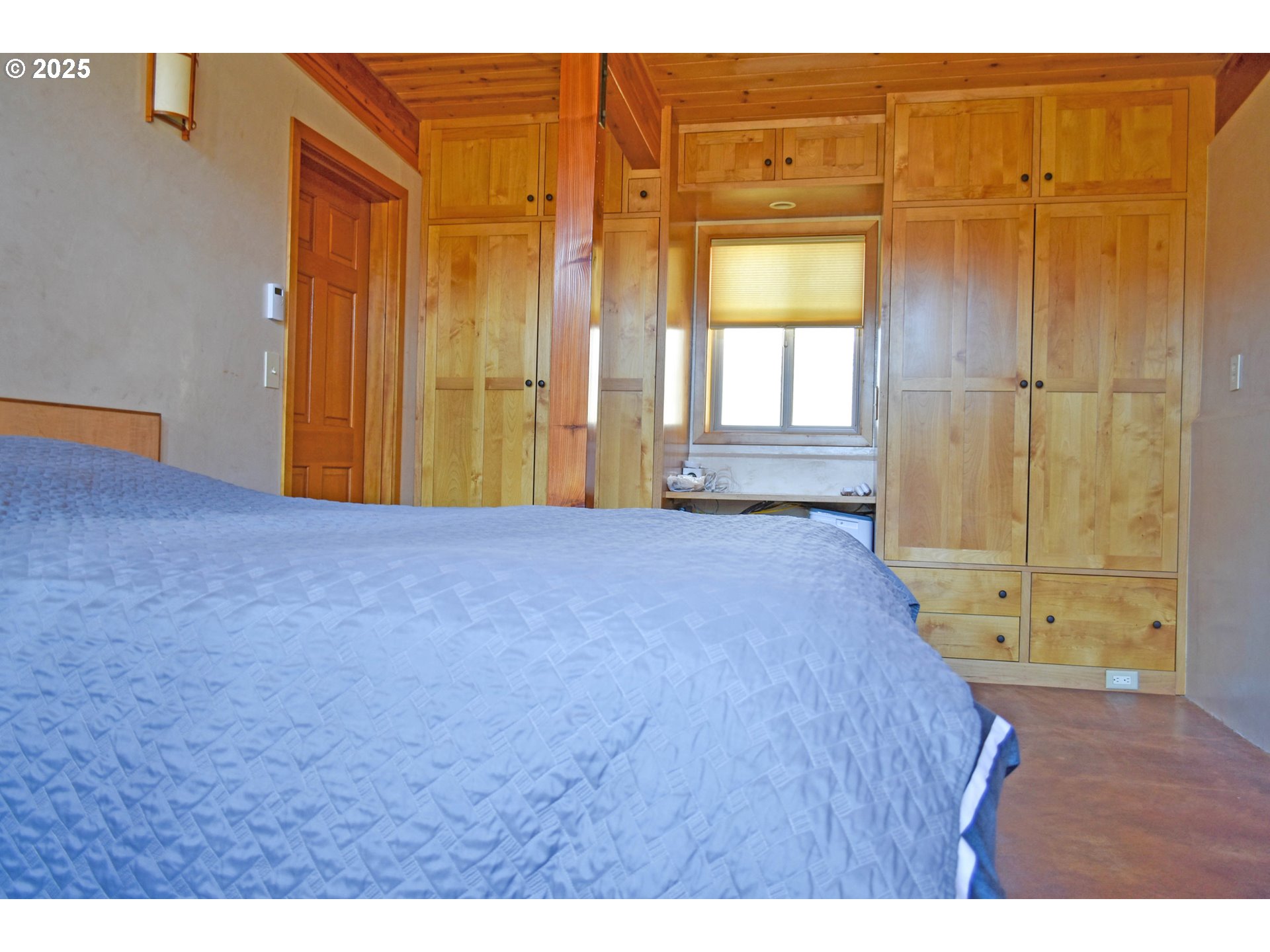 47345 Ritter Road Long Creek, OR 97856 - Photo 21 of 48 a view of an empty room with a birdcage and a window