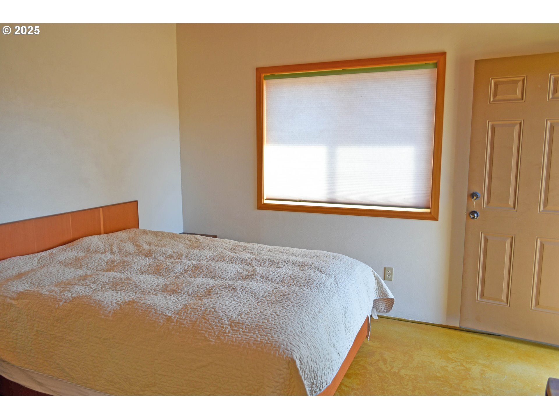 47345 Ritter Road Long Creek, OR 97856 - Photo 27 of 48 a bedroom with a bed and a window