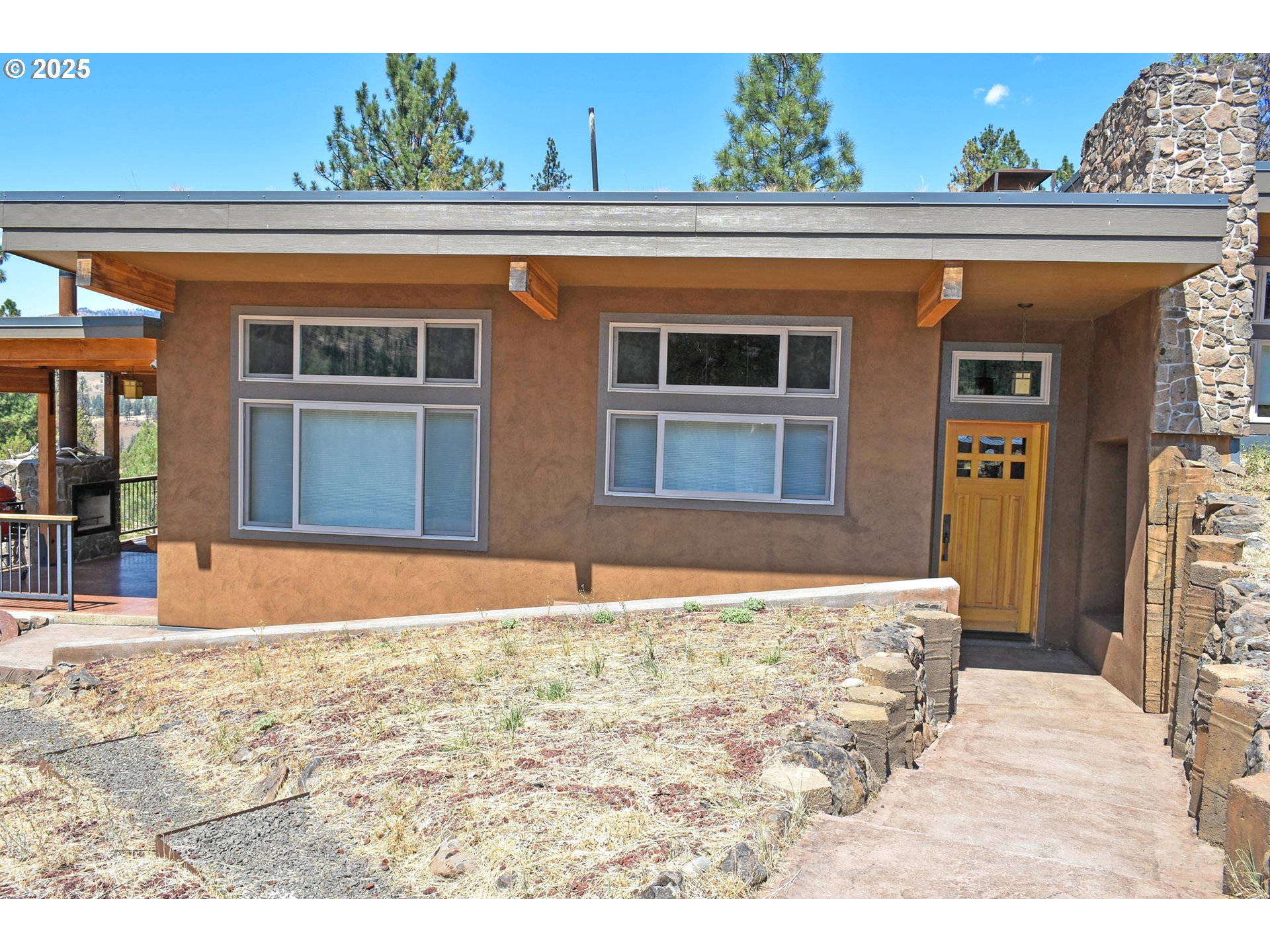 47345 Ritter Road Long Creek, OR 97856 - Photo 5 of 48 a view of a house with a outdoor space