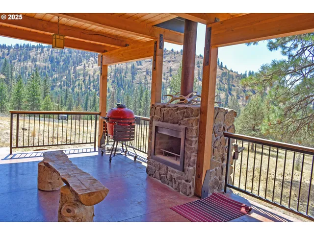 a view of a chairs and table in the patio