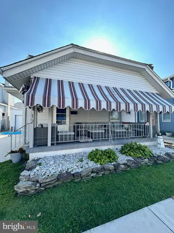 a front view of a house with parking space