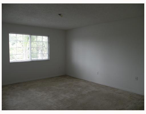 5031 Wiles Road, Unit 203 Coconut Creek, FL 33073 - Photo 5 of 8 Master Bedroom